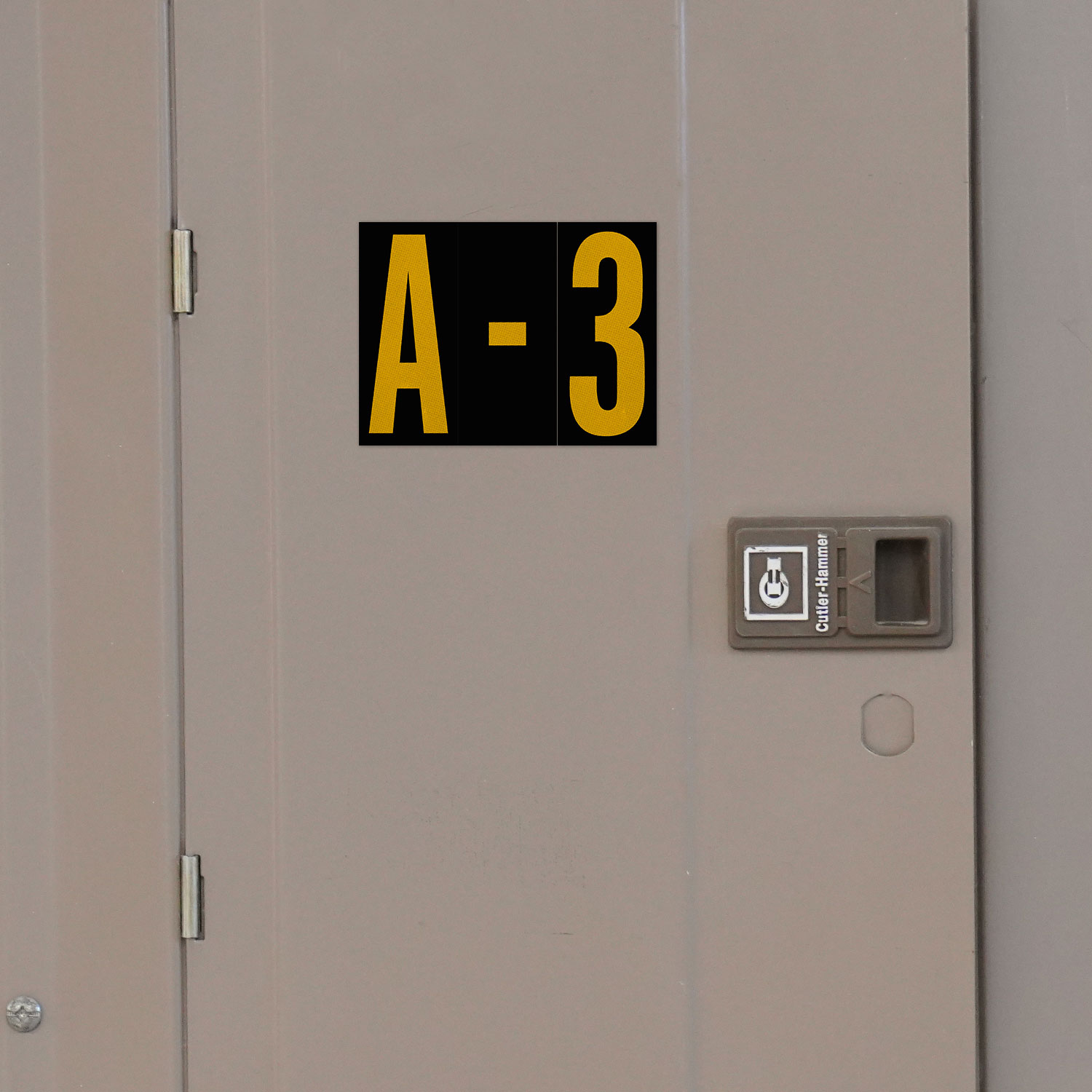 3" Yellow Character on Black EG Reflective Vinyl Label